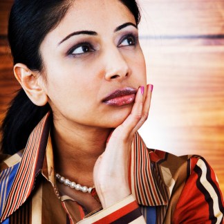 ©Glowimages - woman thinking (Model for illustrative purposes only)